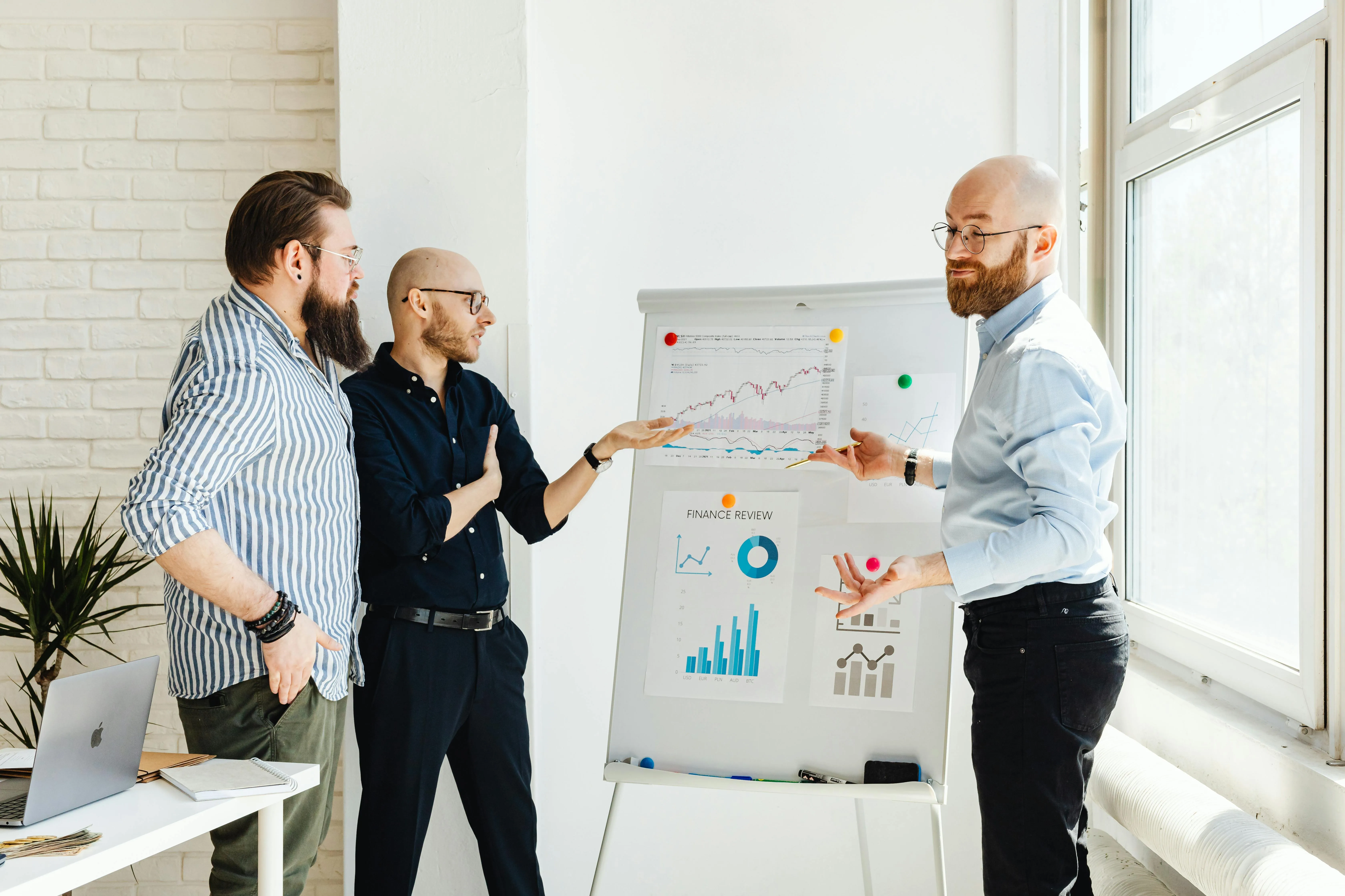 Team collaborating on a whiteboard to plan a startup product